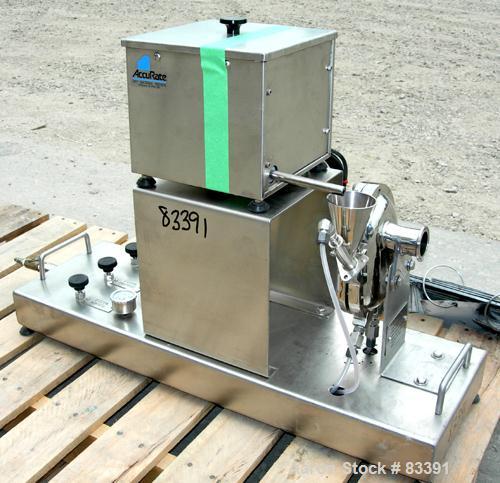 USED: Fluid Energy Aljet mill, 316 stainless steel. Top feed with hopper. 2" tri-clamp outlet. Includes an Accurate feeder with hopper. Mounted on a stainless steel base.