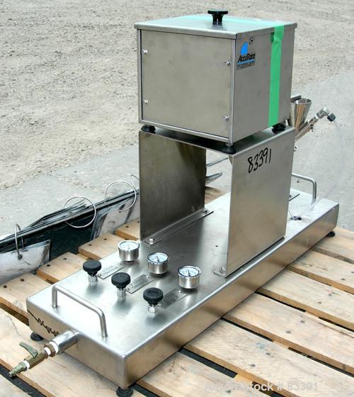 USED: Fluid Energy Aljet mill, 316 stainless steel. Top feed with hopper. 2" tri-clamp outlet. Includes an Accurate feeder with hopper. Mounted on a stainless steel base.