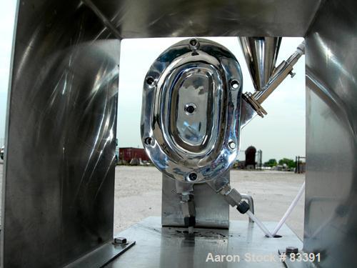 USED: Fluid Energy Aljet mill, 316 stainless steel. Top feed with hopper. 2" tri-clamp outlet. Includes an Accurate feeder with hopper. Mounted on a stainless steel base.