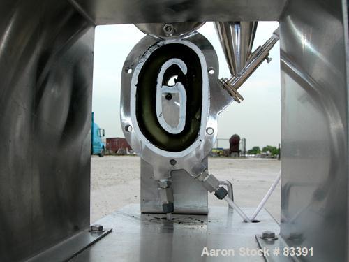 USED: Fluid Energy Aljet mill, 316 stainless steel. Top feed with hopper. 2" tri-clamp outlet. Includes an Accurate feeder with hopper. Mounted on a stainless steel base.