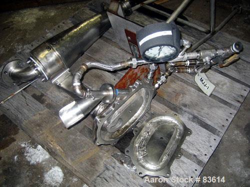USED: Fluid Energy Jet Mizer, model 0202-C65, stainless steel. Vertically oriented jet mill with tangential grinding nozzles. Rated capacity from 1-100 pounds an hour. Requires 50-120 cfm air supply....