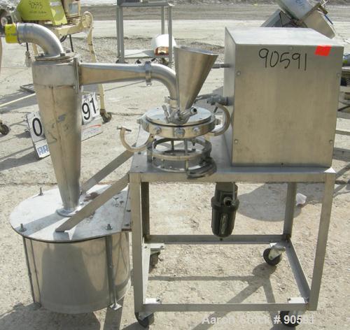Used Sturtevant Micronizer Jet Mill, 316 Stainless Steel. Approximately 8" diameter x 1" deep chamber. Includes a cyclone with collection jar. Mounted on a stainless steel frame with casters.