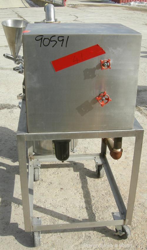 Used Sturtevant Micronizer Jet Mill, 316 Stainless Steel. Approximately 8" diameter x 1" deep chamber. Includes a cyclone with collection jar. Mounted on a stainless steel frame with casters.