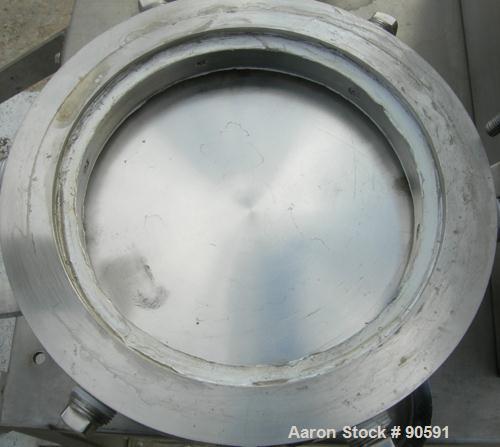 Used Sturtevant Micronizer Jet Mill, 316 Stainless Steel. Approximately 8" diameter x 1" deep chamber. Includes a cyclone with collection jar. Mounted on a stainless steel frame with casters.