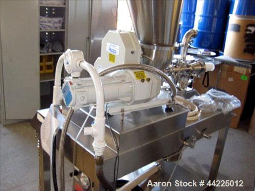 Used Sturtevant Micronizer, Model SSC4. With K-Tron model K2MVT20 feeder, 1/2 hp xp. Cyclone fines collector, on a stainless steel base. Serial #0300702.