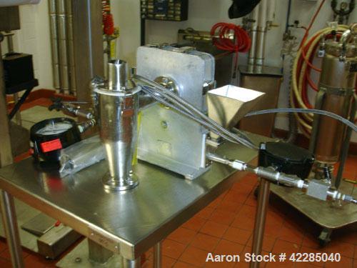 Used Trost 4" Jet Mill, stainless steel. Includes a stand with cyclone and feeder, and external collector. Price includes 15% buyer's premium.