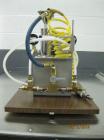 Used Glen Mills 2'' Laboratory Jet Mill, Stainless Steel. Bench top design, size reduction 10 microns and below with cyclone and collection jar.