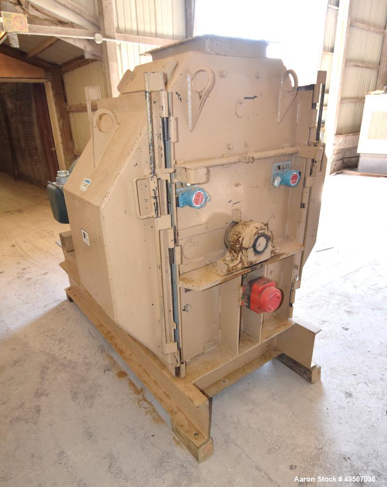 Used Bliss Industries Eliminator Hammer Mill, Model E-3815 TF, Carbon Steel. Approximate 38” diameter x 15” wide rotor with 2-1/2” wide x 1/4” thick swinging hammers. 14" x 12" Top feed with a rotary...