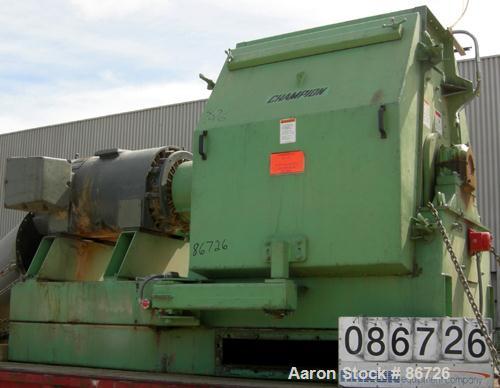 USED: Champion hammermill, model HM54-48, carbon steel. Approximate 54" diameter x 48" wide rotor with (6) rows of (24) 2-1/2" wide x 1/4" thick swing hammers. Teardrop style screen, approximate 7104...