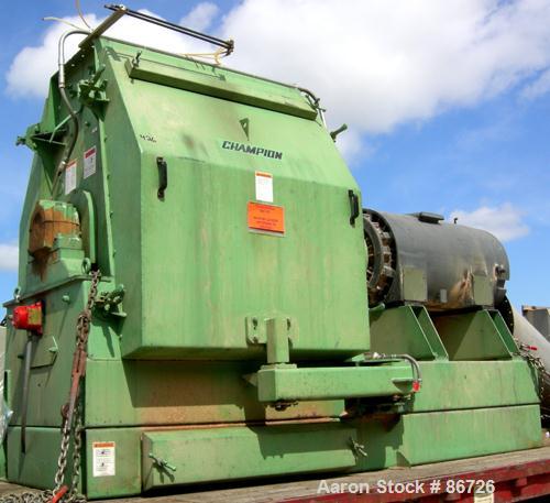 USED: Champion hammermill, model HM54-48, carbon steel. Approximate 54" diameter x 48" wide rotor with (6) rows of (24) 2-1/2" wide x 1/4" thick swing hammers. Teardrop style screen, approximate 7104...