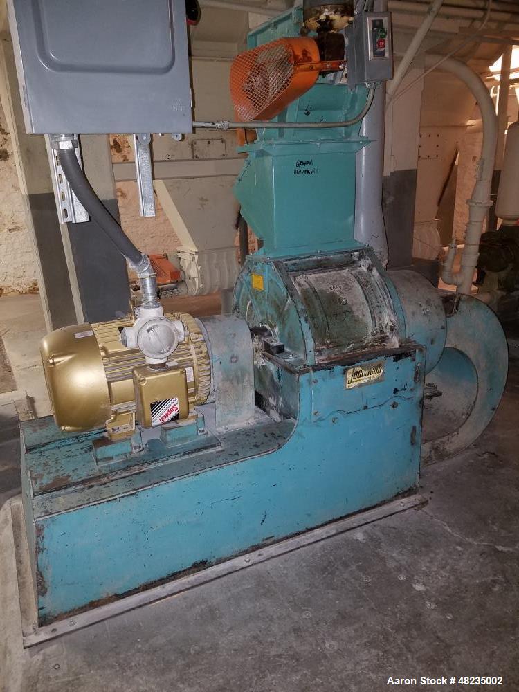 Used Jacobson Hammer Mill, Model IT-24DF10. Includes: 50hp Baldor motor, feeder, magnet, breaker box. Base mounted with bottom discharge with blower. Last used in an agriculture application.
