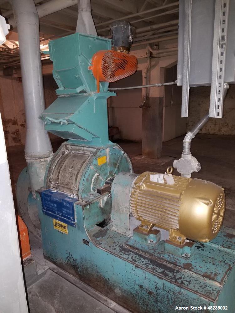 Used Jacobson Hammer Mill, Model IT-24DF10. Includes: 50hp Baldor motor, feeder, magnet, breaker box. Base mounted with bottom discharge with blower. Last used in an agriculture application.