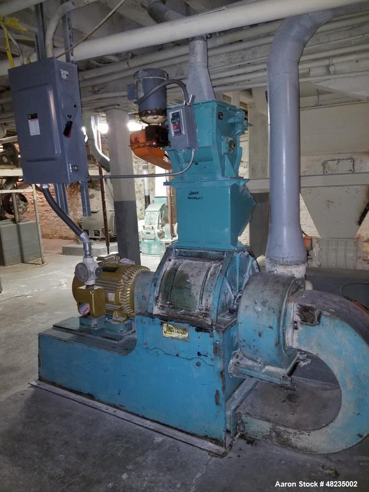 Used Jacobson Hammer Mill, Model IT-24DF10. Includes: 50hp Baldor motor, feeder, magnet, breaker box. Base mounted with bottom discharge with blower. Last used in an agriculture application.