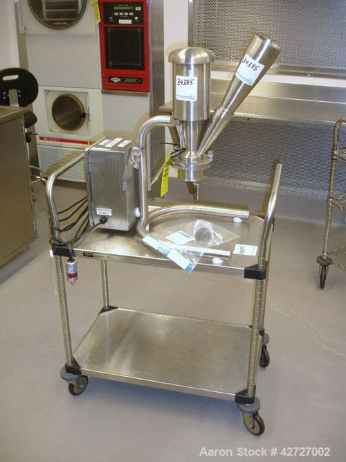 Used Quadro Comil, Model 193, Stainless Steel. Gravity feed with feed chute, beater and screen. Direct coupled .25 hp motor with VFD controller. Bench top design on stand, seria l#0064.  PRICE INCLUD...