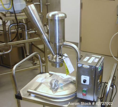 Used Quadro Comil, Model 193, Stainless Steel. Gravity feed with feed chute, beater and screen. Direct coupled .25 hp motor with VFD controller. Bench top design on stand, seria l#0064.  PRICE INCLUD...
