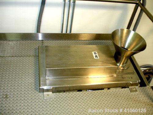 Used Quadro Comil, model 194-S, stainless steel construction, 8" diameter screen, mezzanine mounted with 5 hp, 230/460 volt motor, serial #0664.