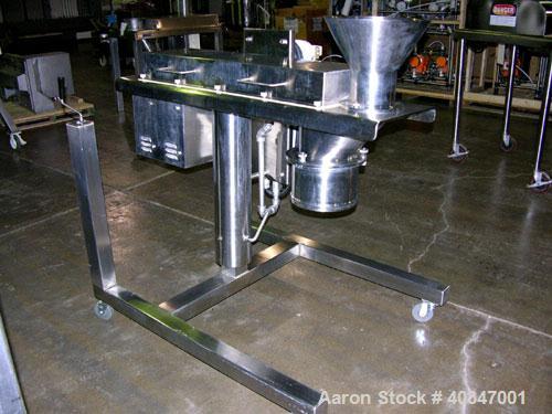 Used Quadro Comil, model 194P, stainless steel. Approximate 8" diameter screen, approximate capacity up to 4000 pounds an hour. Driven by a 5 hp motor with beater. Mounted on a stand.