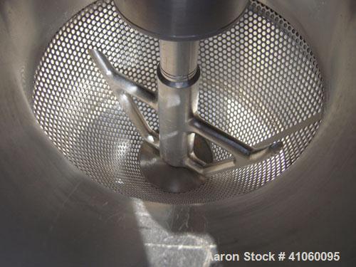 Used Quadro Comil, Model 194S, 316 Stainless Steel. Approximate 8" diameter impeller no screen, approximate capacity up to 4000 pounds an hour. Top feed, bottom discharge with swing away discharge sh...