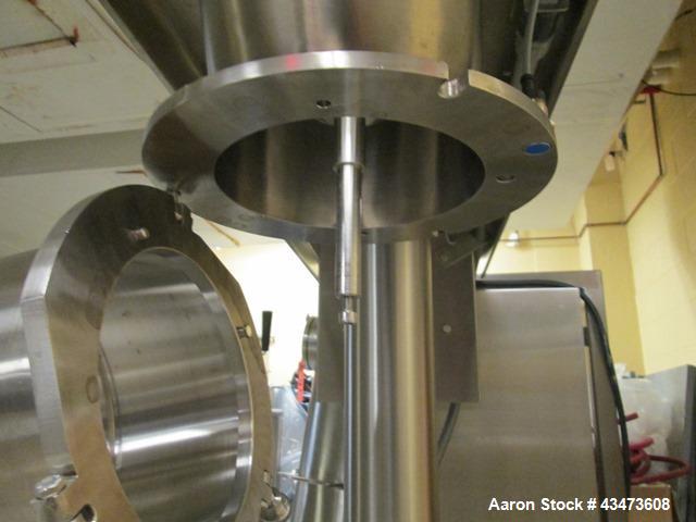 Used Quadro Comil, Model 194. Stainless steel construction, with feed hopper on cantilievered stainless steel base, serial# P194-0945.