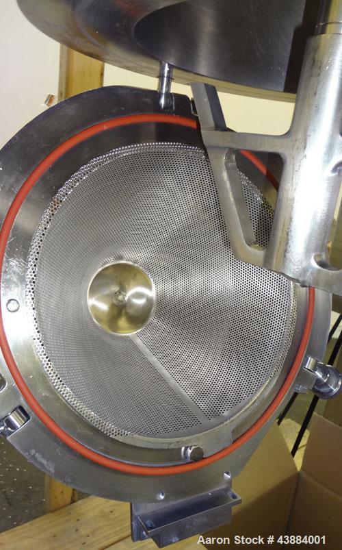 Used Quadro Comil, Model 194 Ultra, 316/304 Stainless Steel. Approximately 8" diameter impeller, with screens. Approximate capacity up to 4000 pounds an hour.  2" Tri-clamp top feed, bottom discharge...