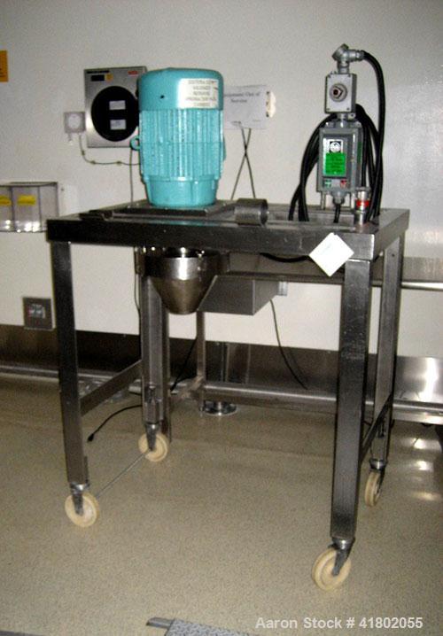 Used Quadro Comil, Model 196, Stainless Steel. Approximate capacity up to 8000 pounds an hour. Top feed, bottom discharge. Driven by a 7-1/2 hp, 3/60/230/460 volt motor. Mounted on stainless steel le...
