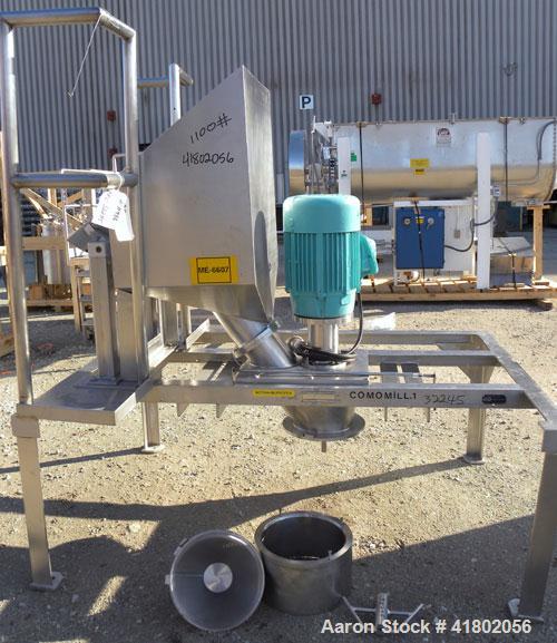 Used Quadro Comil, Model 196, 316 Stainless Steel. Approximate 12" diameter screen,  Approximate capacity up to 8000 pounds an hour. 6’’ diameter top feed with a hopper, and barrel holder, bottom dis...