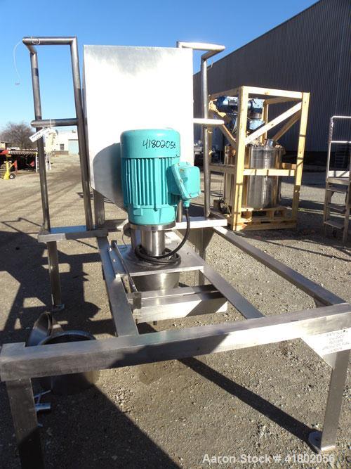 Used Quadro Comil, Model 196, 316 Stainless Steel. Approximate 12" diameter screen,  Approximate capacity up to 8000 pounds an hour. 6’’ diameter top feed with a hopper, and barrel holder, bottom dis...
