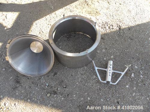Used Quadro Comil, Model 196, 316 Stainless Steel. Approximate 12" diameter screen,  Approximate capacity up to 8000 pounds an hour. 6’’ diameter top feed with a hopper, and barrel holder, bottom dis...