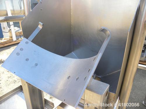 Used Quadro Comil, Model 196, 316 Stainless Steel. Approximate 12" diameter screen,  Approximate capacity up to 8000 pounds an hour. 6’’ diameter top feed with a hopper, and barrel holder, bottom dis...