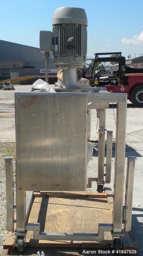 Used Quadro Comil, Model 196, 316 Stainless Steel. Requires an approximate 12" diameter screen.  Approximate capacity up to 8000 pounds an hour. Top feed, bottom discharge. Includes beater bar. Drive...