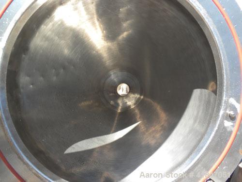 Used Quadro Comil, Model 196, 316 Stainless Steel. Approximate 12" diameter screen,  Approximate capacity up to 8000 pounds an hour. Top feed, bottom discharge. Includes screen, and beater bar. Drive...