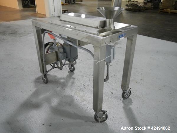 Used Quadro Comil, model 197S, stainless steel construction, with beater, on stainless steel stand with 1 hp, 1745 rpm, 230/460 volt mechanical variable speed motor drive, xp, serial# 197-0430.