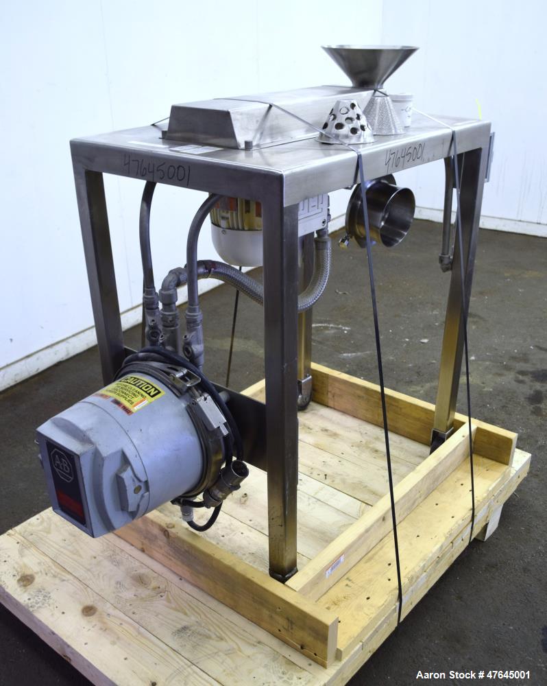 Used Quadro Comil, Model 197S, 316 Stainless Steel. Approximate 5" diameter impeller with screen. Approximate capacity up to 250-750 pounds an hour. Includes a top feed hopper, bottom discharge chute...
