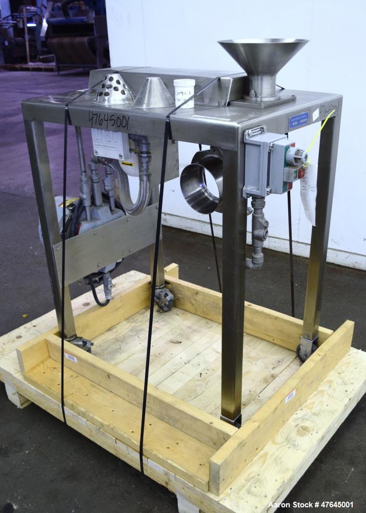 Used Quadro Comil, Model 197S, 316 Stainless Steel. Approximate 5" diameter impeller with screen. Approximate capacity up to 250-750 pounds an hour. Includes a top feed hopper, bottom discharge chute...