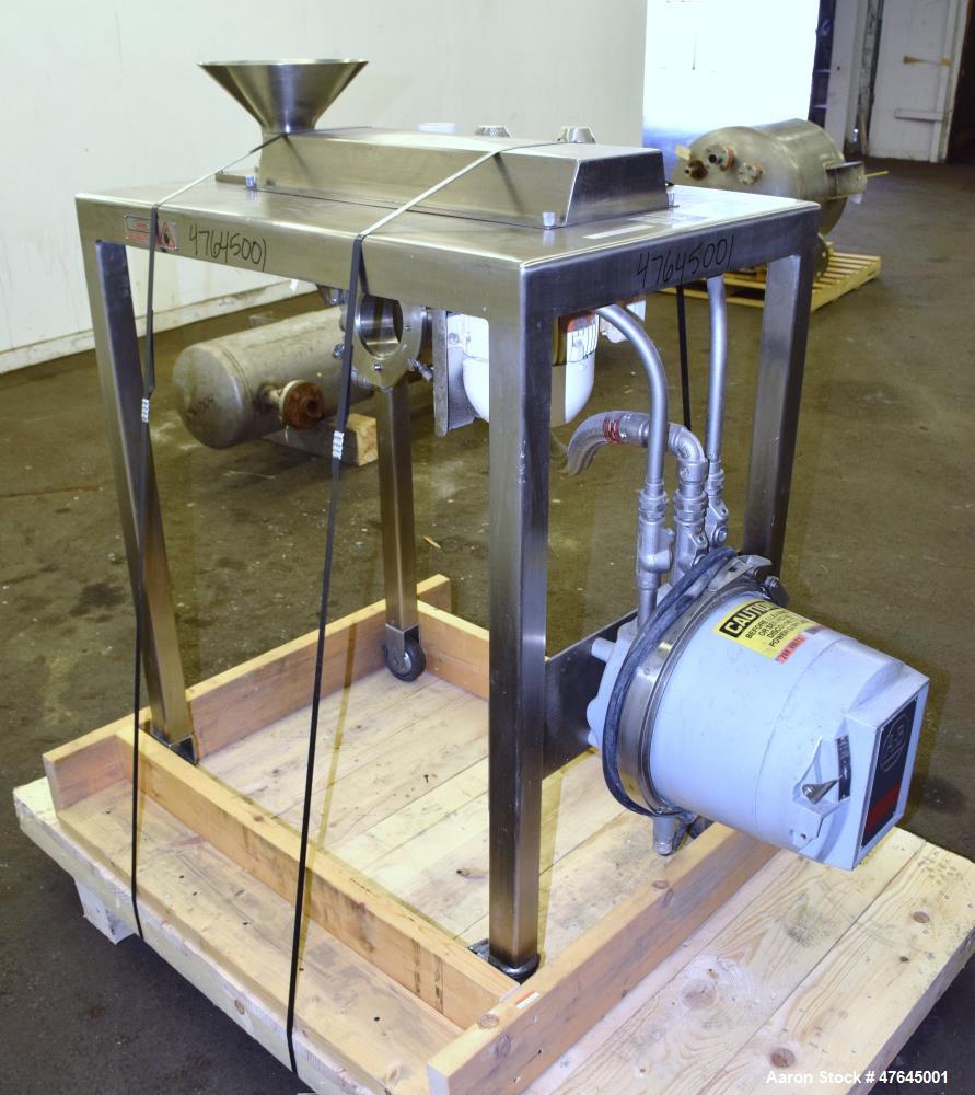Used Quadro Comil, Model 197S, 316 Stainless Steel. Approximate 5" diameter impeller with screen. Approximate capacity up to 250-750 pounds an hour. Includes a top feed hopper, bottom discharge chute...