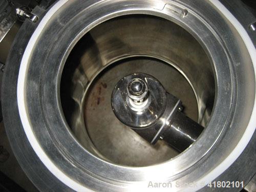 Used Quadro Comil, Model U20, Stainless Steel. Approximate capacity up to 4250 pounds an hour. Top feed, bottom discharge. Driven by an approximate 5 hp motor. Mounted on stainless steel frame with c...