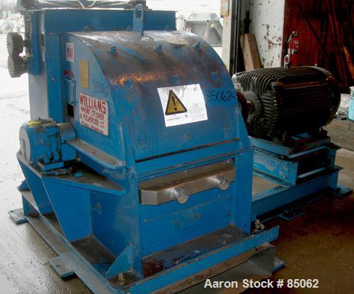 USED: Williams Meteor hammermill, model 26, carbon steel. 32" diameter x 28" wide rotor with 12 rows of (28) 2-1/2" wide x 1/4" thick swinging hammers. Top feed, no hopper, side sheet feed with pneum...