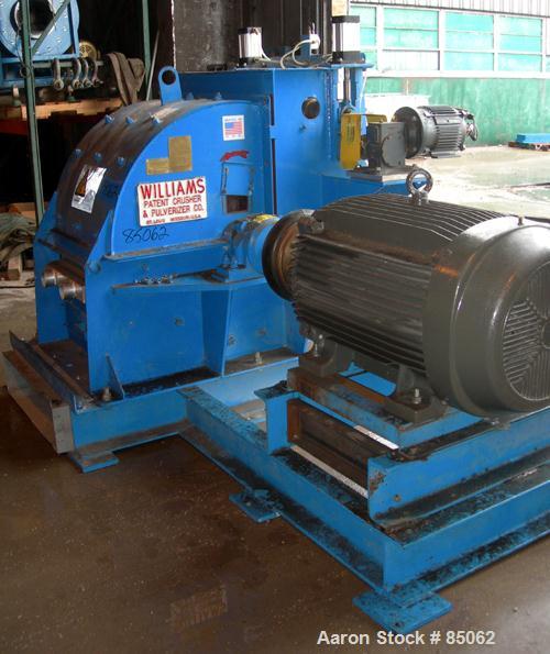 USED: Williams Meteor hammermill, model 26, carbon steel. 32" diameter x 28" wide rotor with 12 rows of (28) 2-1/2" wide x 1/4" thick swinging hammers. Top feed, no hopper, side sheet feed with pneum...