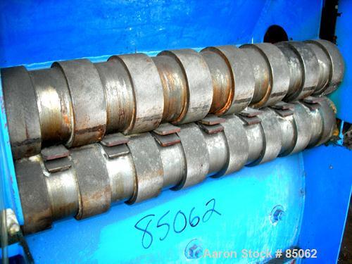USED: Williams Meteor hammermill, model 26, carbon steel. 32" diameter x 28" wide rotor with 12 rows of (28) 2-1/2" wide x 1/4" thick swinging hammers. Top feed, no hopper, side sheet feed with pneum...