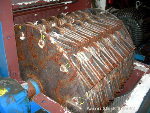 USED: Williams Meteor hammermill, model 26, carbon steel. 32" diameter x 28" wide rotor with 12 rows of (28) 2-1/2" wide x 1/4" thick swinging hammers. Top feed, no hopper, side sheet feed with pneum...