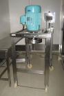 Used Quadro Comil, Model 196, Stainless Steel. Approximate capacity up to 8000 pounds an hour. Top feed, bottom discharge. Driven by a 7-1/2 hp, 3/60/230/460 volt motor. Mounted on stainless steel le...