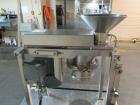 Used Quadro Comil, Model 197S, Stainless Steel. With beater and screen. Mounted on portable cart with 1hp, 230/460 volt XP motor. Serial# 197-1-061.