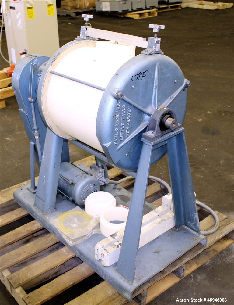 Used Paul O Abbe #4 Jar Mill, Approximate 20 Gallon. Plastic Jar approximate 18" diameter x 20" straight side. Jar speed 39 rpm. Belt driven by .5 hp, 1725 rpm, 208-230/460 volt motor, thru reducer, ...