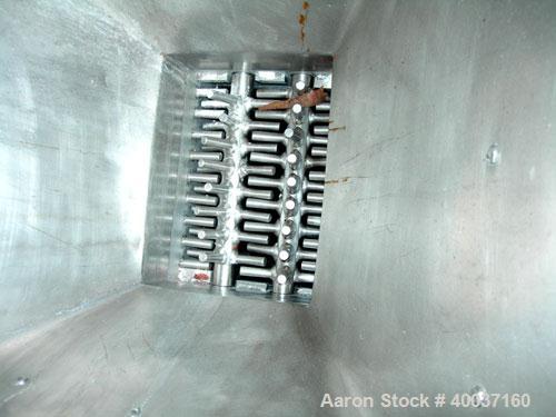 Used Used: Dual shaft delumper, stainless steel. 9" X 11 1/2" feed opening with hopper. Driven by a 1hp,3/60/230/460 volt, 1730 rpm gearmotor. Mounted on a stainless steel frame with casters.