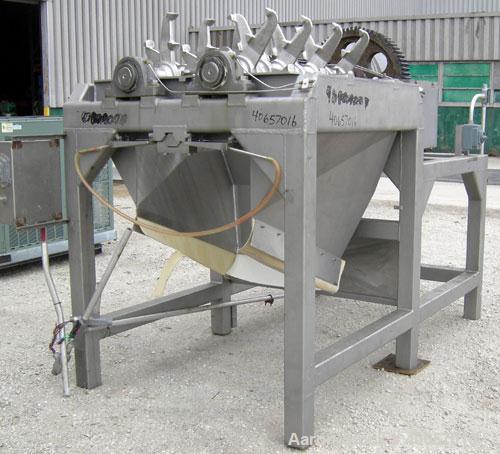 Used Lump Breaker, dual shaft, 304 stainless steel. (1) 4" diameter shaft with (7) 3 blade hook style knives, (1) 4" diameter shaft with (6) 3 blade hook style knives. (2) sets of stationary bars. 40...