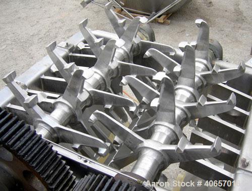 Used Lump Breaker, dual shaft, 304 stainless steel. (1) 4" diameter shaft with (7) 3 blade hook style knives, (1) 4" diameter shaft with (6) 3 blade hook style knives. (2) sets of stationary bars. 40...