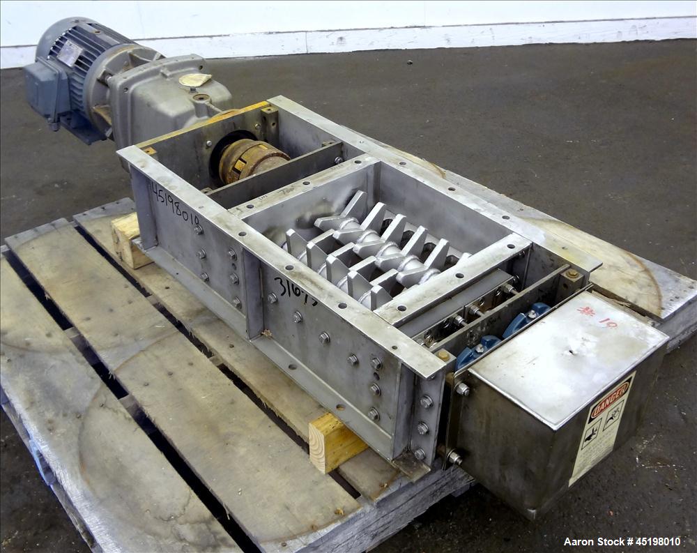 Used Dual Shaft Lump Breaker, 316 Stainless Steel. 12" x 12" Feed, no hopper. Approximate 1/2" thick fixed blades. Driven by a 5hp, 3/60/230/460 volt, 1750 rpm gear motor, ratio 24.41 to 1.