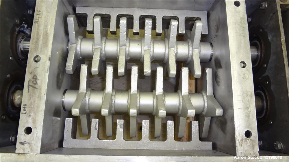 Used Dual Shaft Lump Breaker, 316 Stainless Steel. 12" x 12" Feed, no hopper. Approximate 1/2" thick fixed blades. Driven by a 5hp, 3/60/230/460 volt, 1750 rpm gear motor, ratio 24.41 to 1.