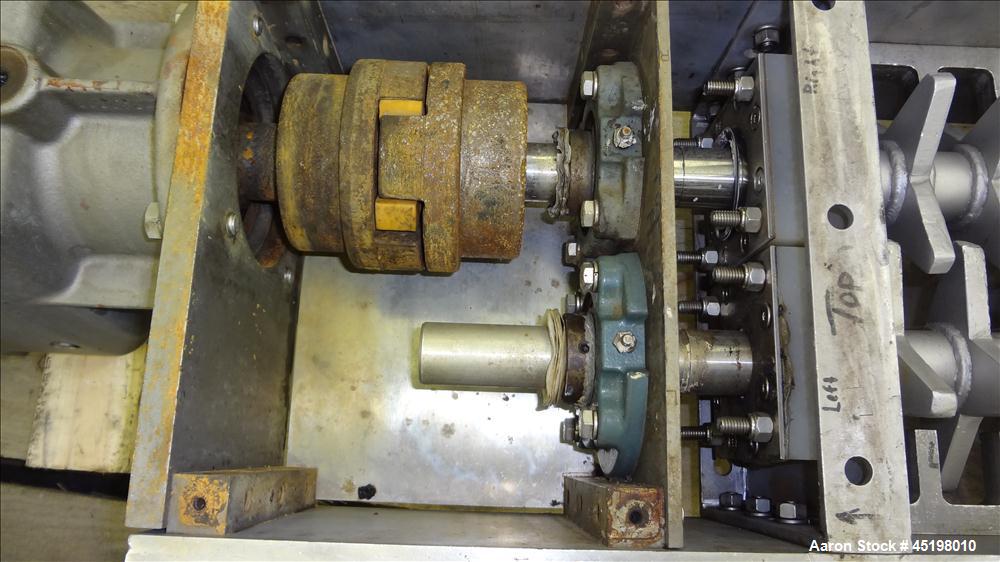 Used Dual Shaft Lump Breaker, 316 Stainless Steel. 12" x 12" Feed, no hopper. Approximate 1/2" thick fixed blades. Driven by a 5hp, 3/60/230/460 volt, 1750 rpm gear motor, ratio 24.41 to 1.