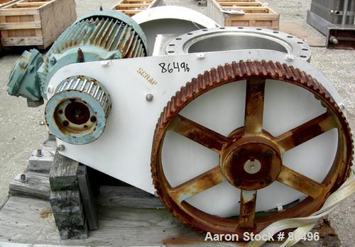 Used Franklin Miller Inline Pipe Delumper, Model PD24, 304 Stainless Steel. Approximate 24" diameter opening, 32" OD mounting flange. 5-1/2" diameter shaft with 9 rotating knives approximately 1" thi...